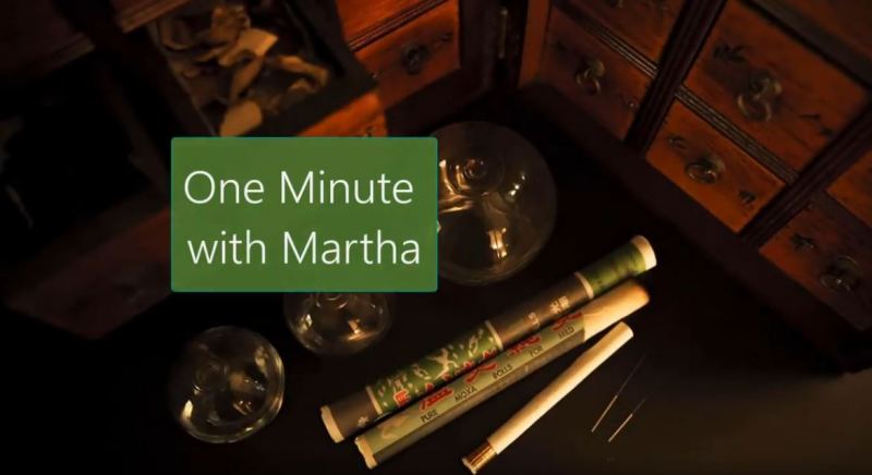 A table with cups and cigarettes, along with the words 'One Minute with Martha'